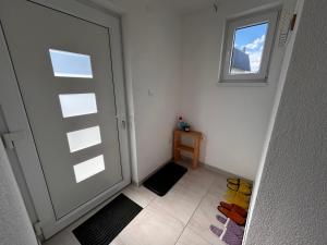 an empty room with a door and a window at Vikendica Nuhanović - Vlašić in Vlasic +27 photos
