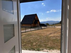 a view of a barn from a window at Vikendica Nuhanović - Vlašić in Vlasic