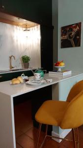 a kitchen with a counter with some food on it at Il Sonetto Boutique Apartment - private garage in Mantova