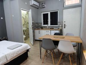 a bedroom with a table and chairs and a bed at Apartment Sekulovski in Ohrid