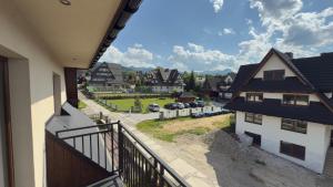 a balcony of a house with a view of a street at Willa Agma in Zakopane