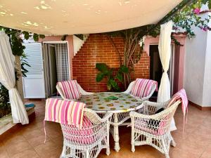 a patio with a table and chairs on a porch at Summer house Mokka in Silba