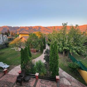an aerial view of a garden with trees and benches at Merlo Trail Lodge in La Porteña