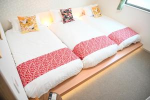 Ένα ή περισσότερα κρεβάτια σε δωμάτιο στο 大阪梅田淀川花民宿201套房