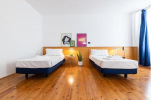 Postel nebo postele na pokoji v ubytování MAB - Maison des Artistes Bard