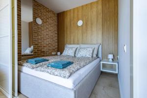 Ένα ή περισσότερα κρεβάτια σε δωμάτιο στο Apartament Stranda C303