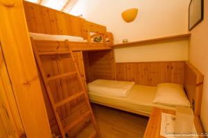 a room with two bunk beds and a table at Ca' Dei Fazzilisti in Mori