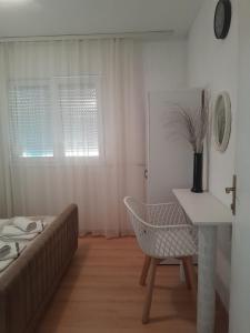 Postel nebo postele na pokoji v ubytování Apartmani Nis