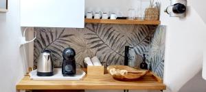 a shelf with bottles and other items on it at Tirella Home in Modica