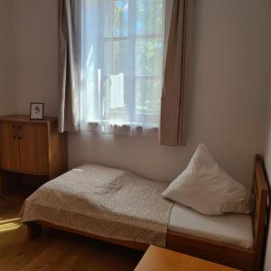 Postel nebo postele na pokoji v ubytování Villa Musik - apartments in historical Villa , Baden
