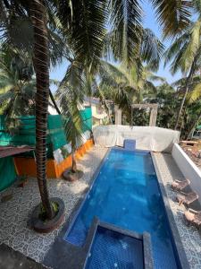 Bazén v ubytování Aura rooms & swimming pool, calangute nebo v jeho okolí