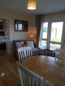 a living room with a table and a couch at Seaview House in Carrick