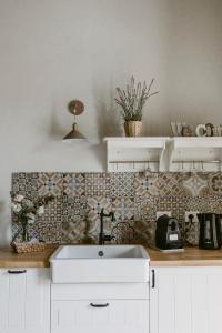 A kitchen or kitchenette at LA CASETTA Malpensa Guesthouse