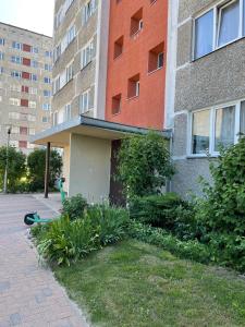 aartment building with a garden in front of it at ''Kristall'' in Ventspils