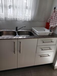 a kitchen with a sink and a counter top at Townview Estate in Ladysmith