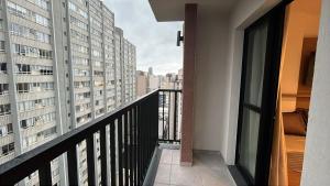 a balcony with a view of a city at IBZ1308 - Studio C Sacada Pscina Jacuzzi Academia in Curitiba