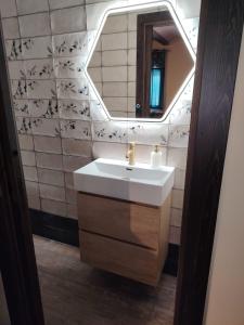 a bathroom with a sink and a mirror at Casas del Barranco de la Hoz in Ventosa +50 photos