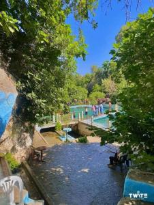 a view of a swimming pool in a park at دوار المروج بوعادل تاونات in Taounate