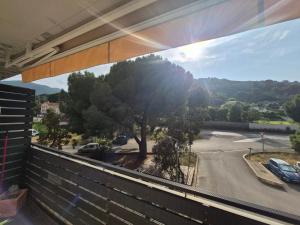 a view from a window of a parking lot at Studio cosy climatisé in Lucciana