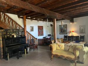 a living room with a couch and a fireplace at Painter's House Historic Stone Villa with Sea View in Perast
