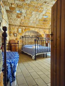 Postel nebo postele na pokoji v ubytování B&B Pergulea