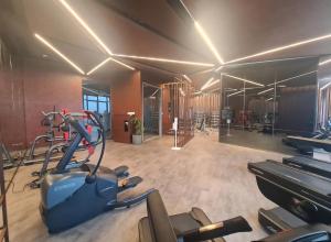 a gym with cardio equipment and a treadmill at The Edge Central Pattaya - Unique & Luxurious in Pattaya Central