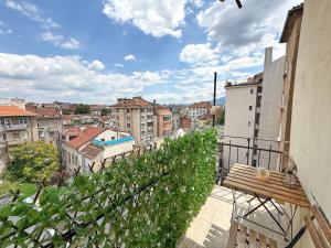 a balcony with a bench and a view of a city at Main Street Sunshine 2 KING Bdr in Sofia