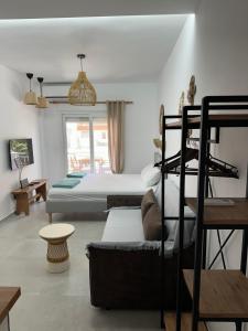 a bedroom with two beds and a bunk bed at VMJ side sea view in Perea