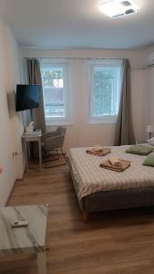 Posteľ alebo postele v izbe v ubytovaní Apartments Olivia + 18 fotografií