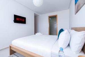 Ένα ή περισσότερα κρεβάτια σε δωμάτιο στο Appartement Moderne avec Piscine