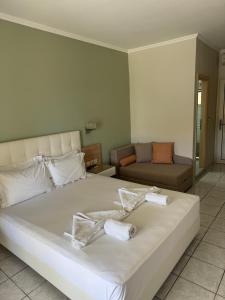 Postel nebo postele na pokoji v ubytování Palm Trees Hotel