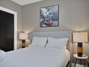 a bedroom with a bed and a picture of a boat at Comfortable 3BR Getaway in Riverview