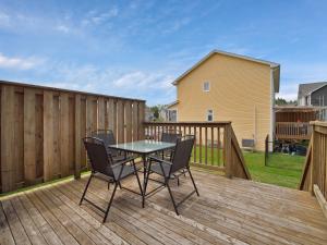 a patio with a table and chairs on a deck at Comfortable 3BR Getaway in Riverview