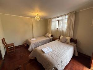 Ένα ή περισσότερα κρεβάτια σε δωμάτιο στο Casa Lima