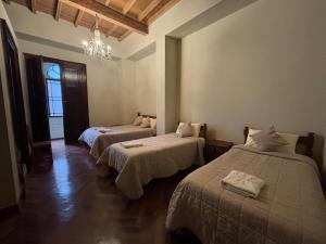 Ένα ή περισσότερα κρεβάτια σε δωμάτιο στο Casa Lima