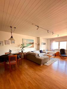 a living room with a couch and a table at Villa Forever More in Kaštela