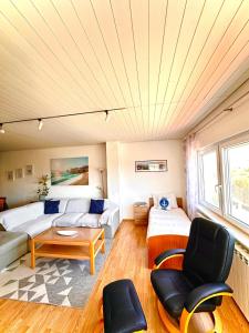 a living room with a couch and a table at Villa Forever More in Kaštela