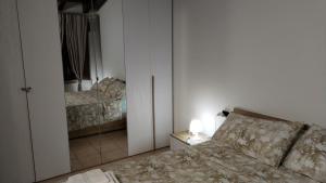 Postel nebo postele na pokoji v ubytování Apartment Artemisia - Cantù Centro