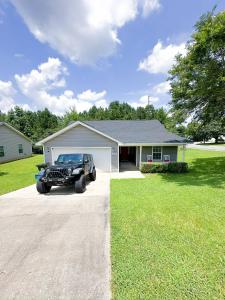 a jeep parked in front of a house at Crescent Gardens-3 Miles from UA in Tuscaloosa