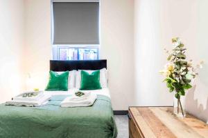 A bed or beds in a room at Forest Fields Studios Nottingham