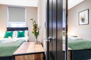 A bed or beds in a room at Forest Fields Studios Nottingham