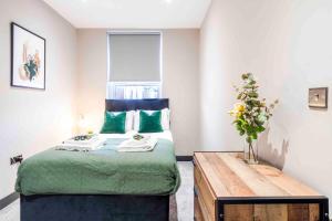 A bed or beds in a room at Forest Fields Studios Nottingham