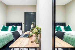 A bed or beds in a room at Forest Fields Studios Nottingham