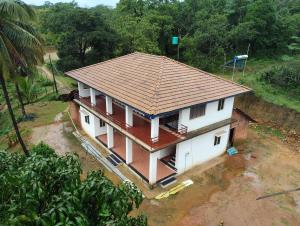 an overhead view of a house with a roof at Gubbikanta Homestay in Aralagodu +7 photos
