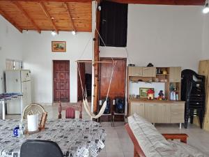 a living room with a hammock in the middle of a room at La Paskana in La Caldera