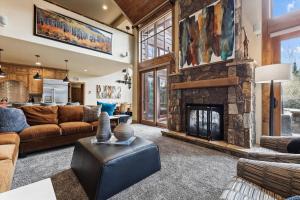 a living room with a couch and a fireplace at Trot Ski-House in Breckenridge