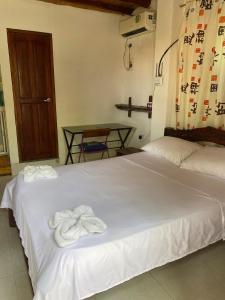 Ένα ή περισσότερα κρεβάτια σε δωμάτιο στο Apartamento Mar Azul palomino