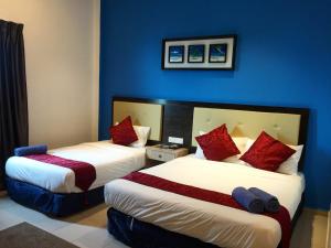 Ein Bett oder Betten in einem Zimmer der Unterkunft Royal Agate Beach Resort
