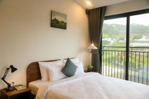 Voodi või voodid majutusasutuse QR Hotel Dalat toas