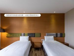 Voodi või voodid majutusasutuse Hualien Toongmao Resort toas